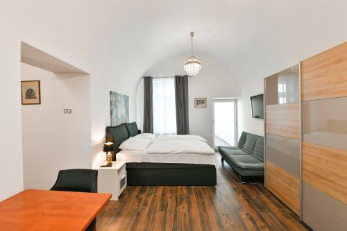 Postel nebo postele na pokoji v ubytování Apartmány Na Náměstí 85