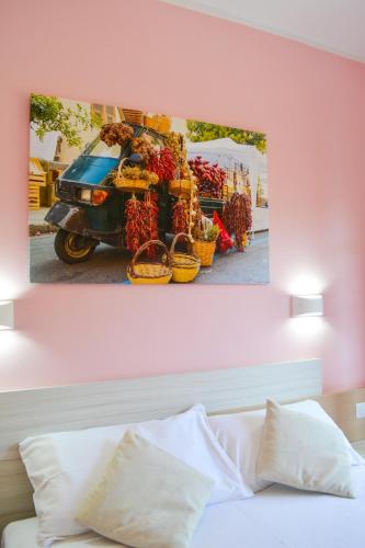 a picture of a truck with baskets of fruit at Le Twins -Bed and Breakfast in Tropea
