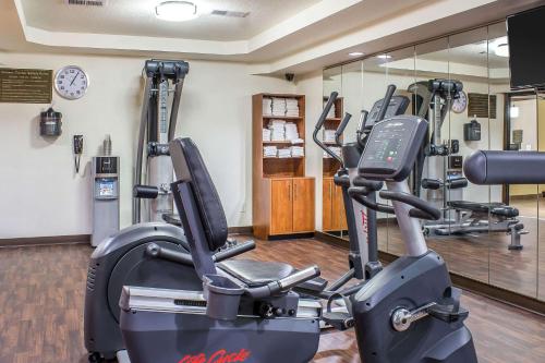 a gym with two tread machines and a treadmill at Comfort Inn & Suites Cedar Rapids North - Collins Road in Cedar Rapids