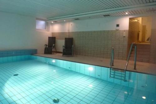 a large swimming pool with a pool at Vik1_17 in Westerland (Sylt)