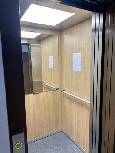 a room with a door with a mirror at Oceanica by Smir Park luxury apartment Marina Smir in M'diq