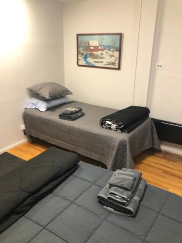 a small room with a bed and a couch at Art Gallery Hostel in Whitefield