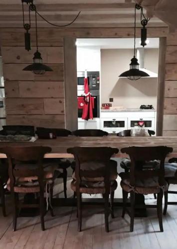 a kitchen with a large wooden table and chairs at Chalet de vacaciones Tartera-Prats i Sansor in Prats i Sansor