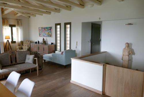 a living room with a couch and a table at Art Villa Pelion in Agria