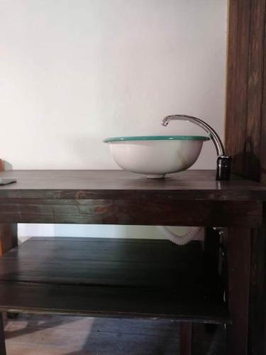 a bowl sitting on top of a wooden table at Casale Valentini in Fermo
