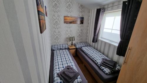 Кровать или кровати в номере Seacottage Brugge - Blankenberge - De Haan