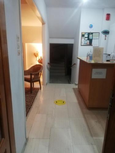 a hallway with a yellow frisbee on the floor at Penelope -Πηνελόπη in Loutra Edipsou