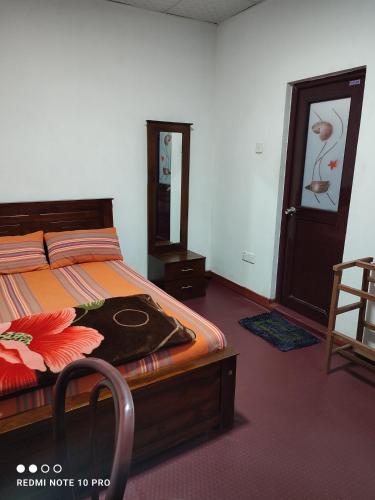 Ένα ή περισσότερα κρεβάτια σε δωμάτιο στο GREENISH INN (ROOMS)