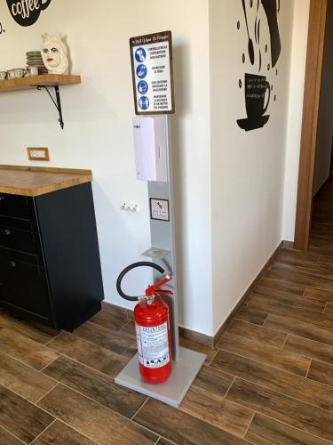 a fire extinguisher sitting on the floor of a kitchen at B & B Vigna Di Filippo - Paestum in Paestum