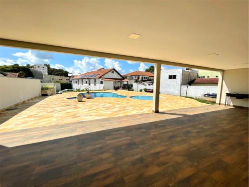 a view from the inside of a house with a patio at Pousada do Duque in Lambari