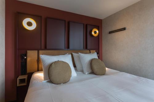 Ένα ή περισσότερα κρεβάτια σε δωμάτιο στο Hotel de Timmerfabriek I Kloeg Collection