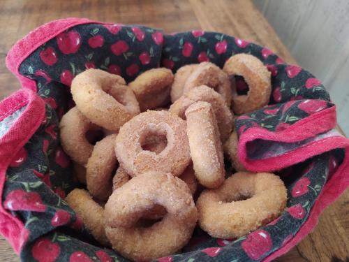 a bunch of donuts in a bowl on a table at Pousada do Duque in Lambari