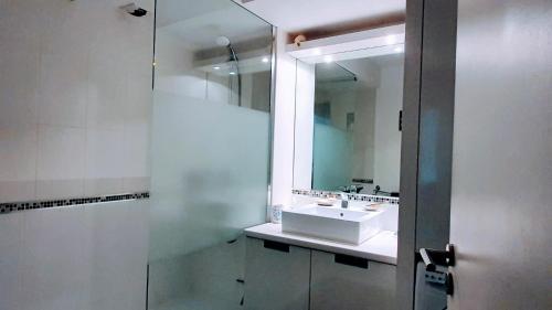 a bathroom with a sink and a mirror at appartement résidence La Plage 4 **** in La Londe-les-Maures