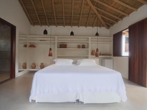 Cama o camas de una habitación en Pousada Seis e Meia