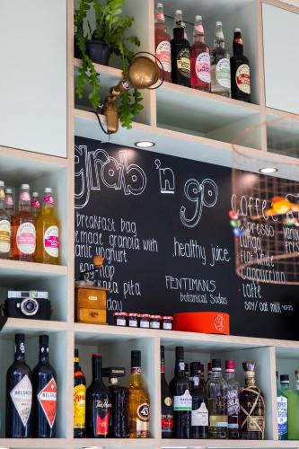 a chalkboard with drinks on a shelf in a store at the bellhop in Rotterdam