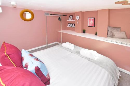 a room with a bed and a shelf at London House by YourStays - 5 Bedroom House in Newcastle-under-Lyme in Stoke on Trent