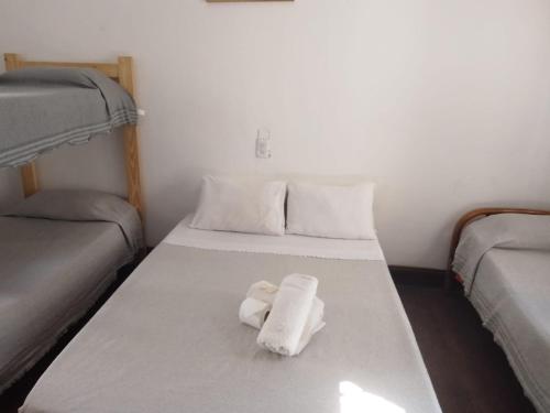 Säng eller sängar i ett rum på La Casona-Hotel