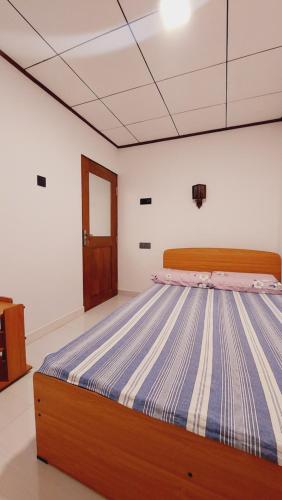 Ένα ή περισσότερα κρεβάτια σε δωμάτιο στο Little Cottage Villa