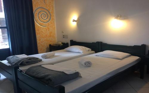 Postel nebo postele na pokoji v ubytování Renia Hotel Agia Pelagia -Crete