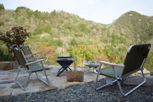 a group of chairs and a table and a grill at OldbutNew 蔵 in Hara