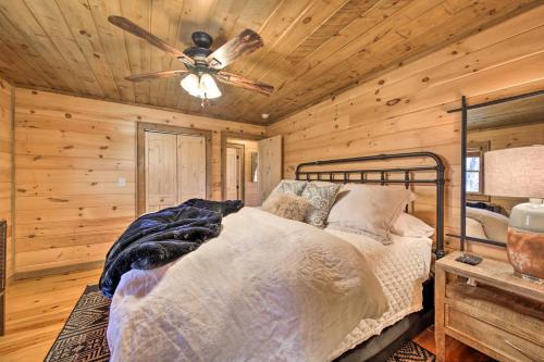 a bedroom with a bed and a ceiling fan at Stunning Escape with Loft, Hot Tub and Mtn Views! in Morganton