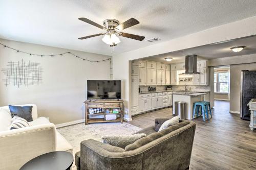 a living room with two couches and a ceiling fan at 1 Mi to ATandT Stadium Downtown Arlington Home in Arlington