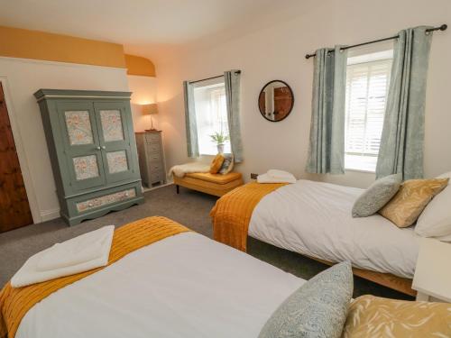 Postel nebo postele na pokoji v ubytování Woolley Lodge