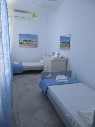 Postel nebo postele na pokoji v ubytování Zenith Luxury Apartments Near Kaiki Beach