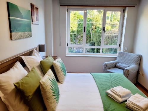 A bed or beds in a room at Piso con garaje en la entrada del camino portugués
