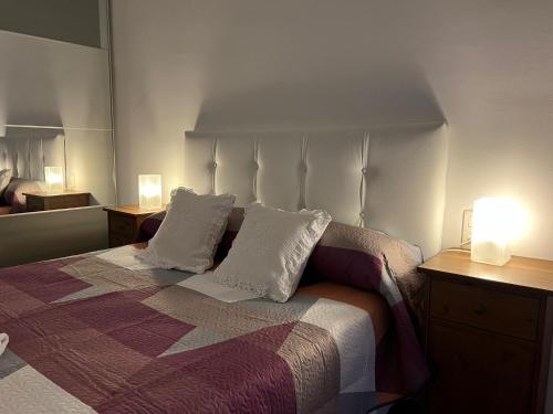 En eller flere senge i et værelse på Apartamento El Jardín