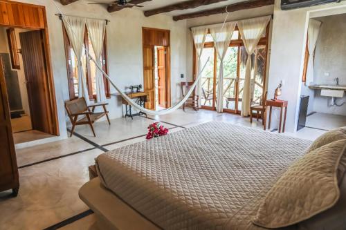 Postel nebo postele na pokoji v ubytování La Casa de Mia Holbox