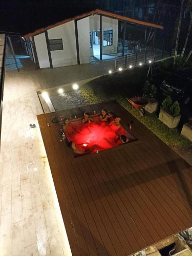 a fire pit on a wooden deck at night at GatoPardo in Montenegro
