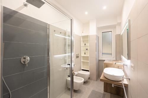 a bathroom with a shower and a toilet and a sink at Matilde Modern apartment-Rental in Rome in Rome
