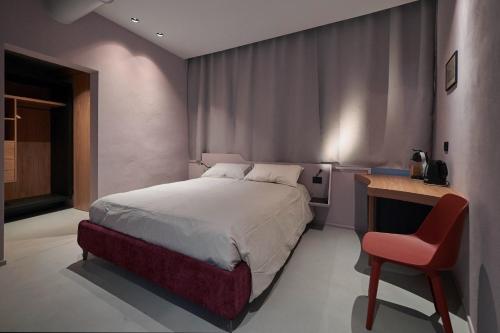 En eller flere senge i et værelse på Locanda dell'Orsa