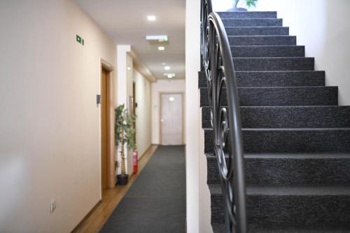 a set of stairs in a hallway at Hotel Garden in Novi Sad