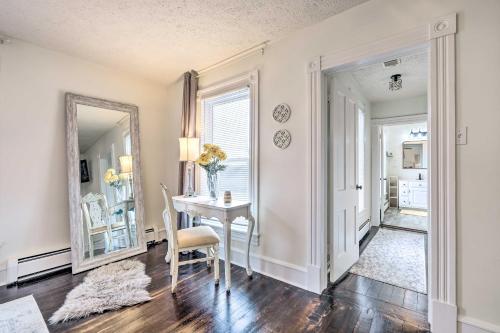 a dining room with a table and a mirror at Lush, Modern Farmhouse with Mtn Views and Sunroom in Edinburg