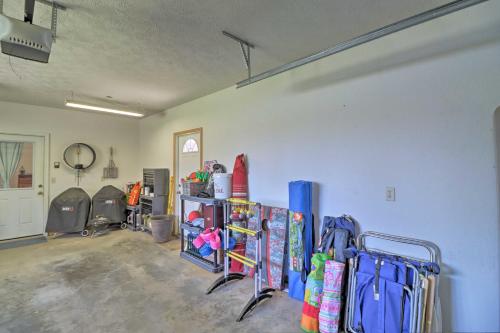 a room with a bunch of snowboards on a wall at Scenic Riverview Getaway with Screened Porch! in Norfork