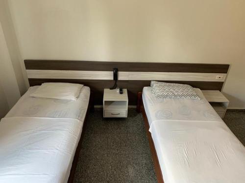 A bed or beds in a room at HOTEL QUALITY