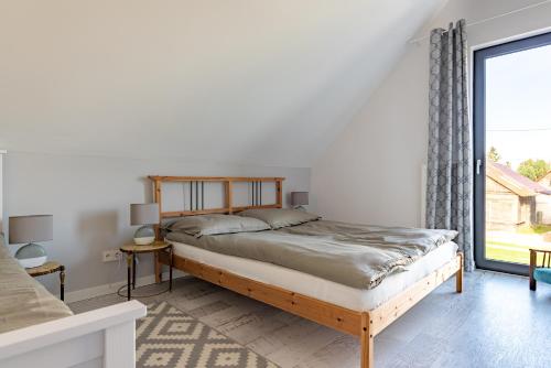 Posteľ alebo postele v izbe v ubytovaní Noclegi LIW APARTMENTS Hotel Apartamenty