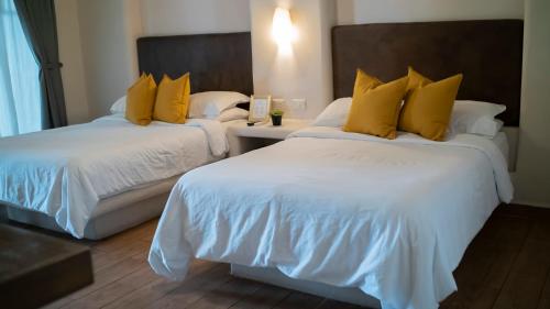 Кровать или кровати в номере Hacienda 1800