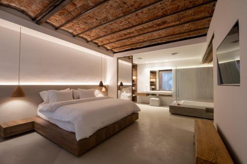 Säng eller sängar i ett rum på Azur Real Hotel Boutique & Spa