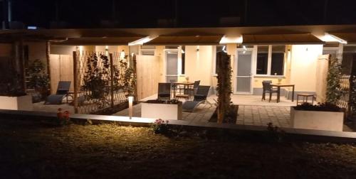 a house with a patio at night at Bamboo in Procida