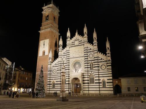 a large building with a christmas tree in front of it at Locanda San Paolo in Monza