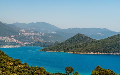 a view of a body of water with mountains at Kaş Sun Glare Hotel in Kas