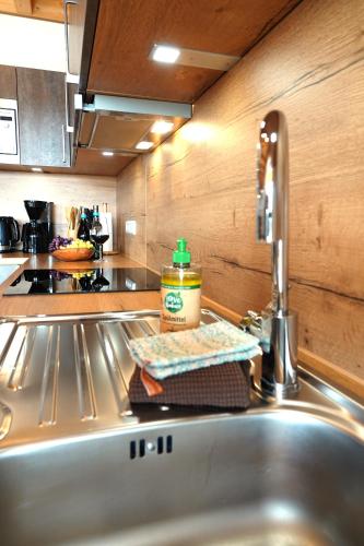 a kitchen sink with a jar of peanut butter on it at Weinbergshof Rickel in Kitzingen