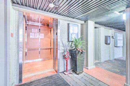 a front door of a building with a fire hydrant at Fernandina Beach Condo about 1 Mi to Golf Courses in Fernandina Beach