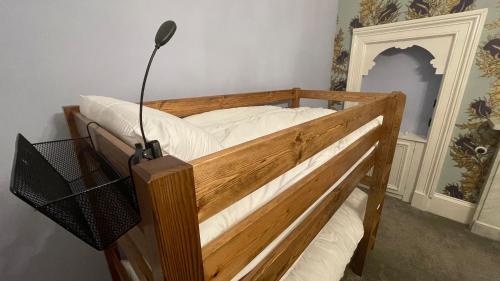 Ένα ή περισσότερα κρεβάτια σε δωμάτιο στο Moffat Independent Hostel