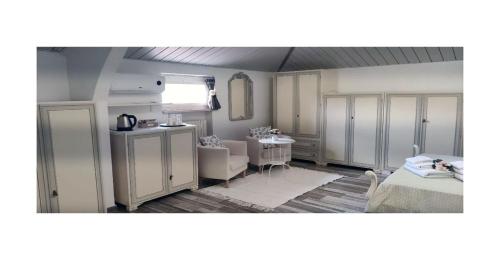 a room with a bed and a room with a table at Il Pittore di Stelle B&B in Boissano