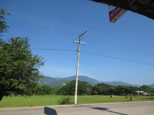 a telephone pole on the side of a road at Hotel Campo Real Plus Tamasopo in Tamasopo