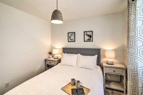 a bedroom with a bed and two night stands at The Rookery - Dreamy Home with Private Dock! in Yelm